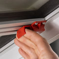 Red Emergency Pull Latch Close-Up on Hengs 48621-C2 RV Escape Hatch - Hardware Detail | United RV Parts